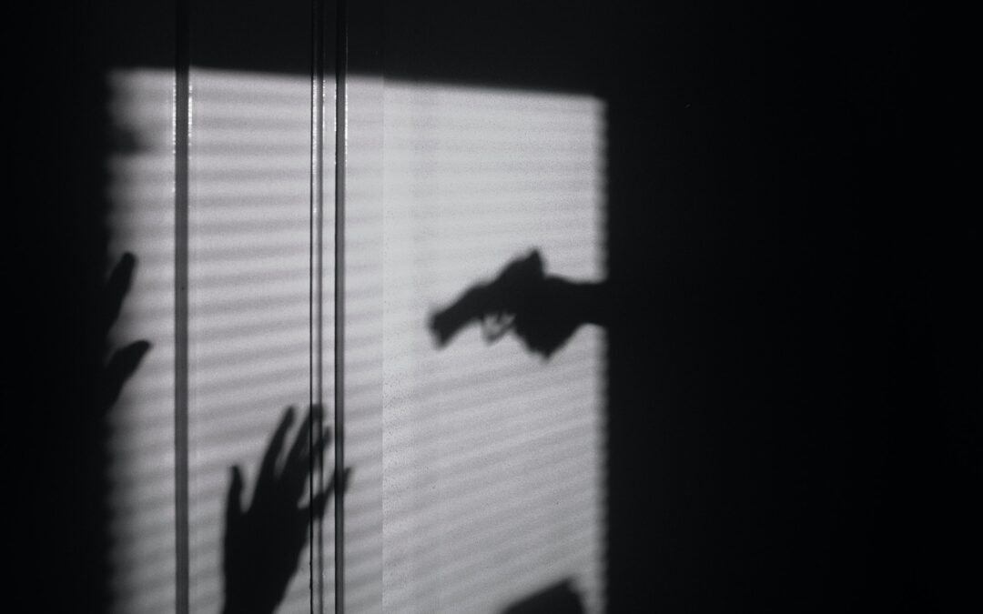 gun crime shadow with hands