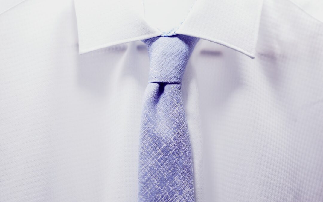 white collar and blue tie